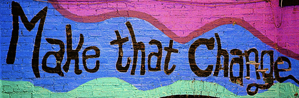 A mural saying, "Make That Change"
