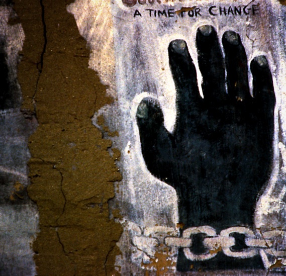 A mural of a chianed hand