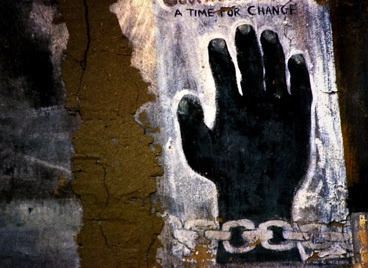 A mural of a chianed hand