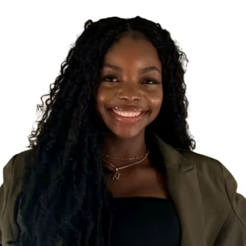 Black woman with dark green coat smiles