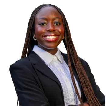 African American woman in navy blazer smiling