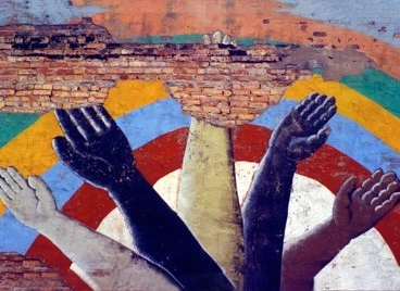 A mural of raised hands of different races