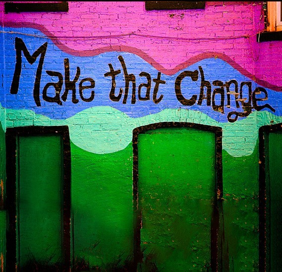 A mural saying "Make that Change"